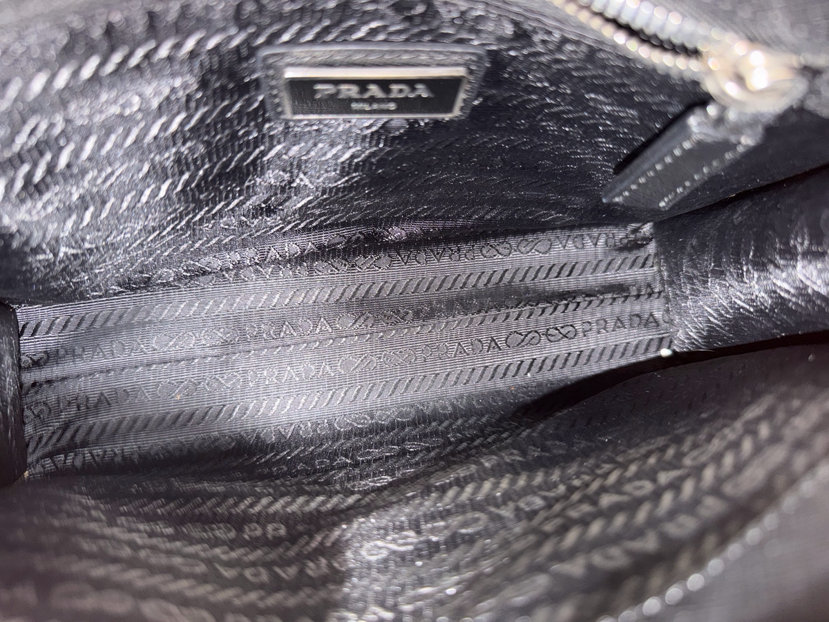 Prada Saffiano Zipper Clutch In Black